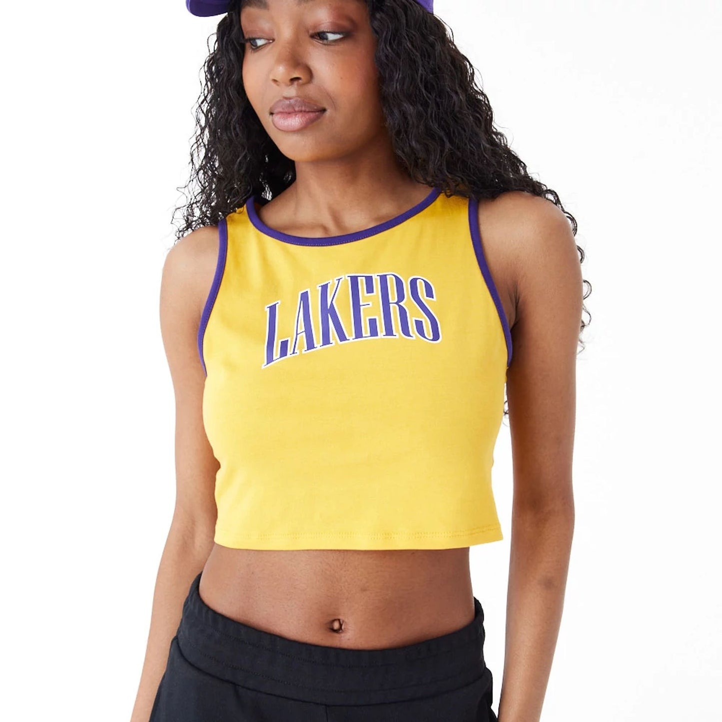 The Female model is wearing LA Lakers Womens Womens NBA Team Wordmark Yellow Crop Tank Top 2