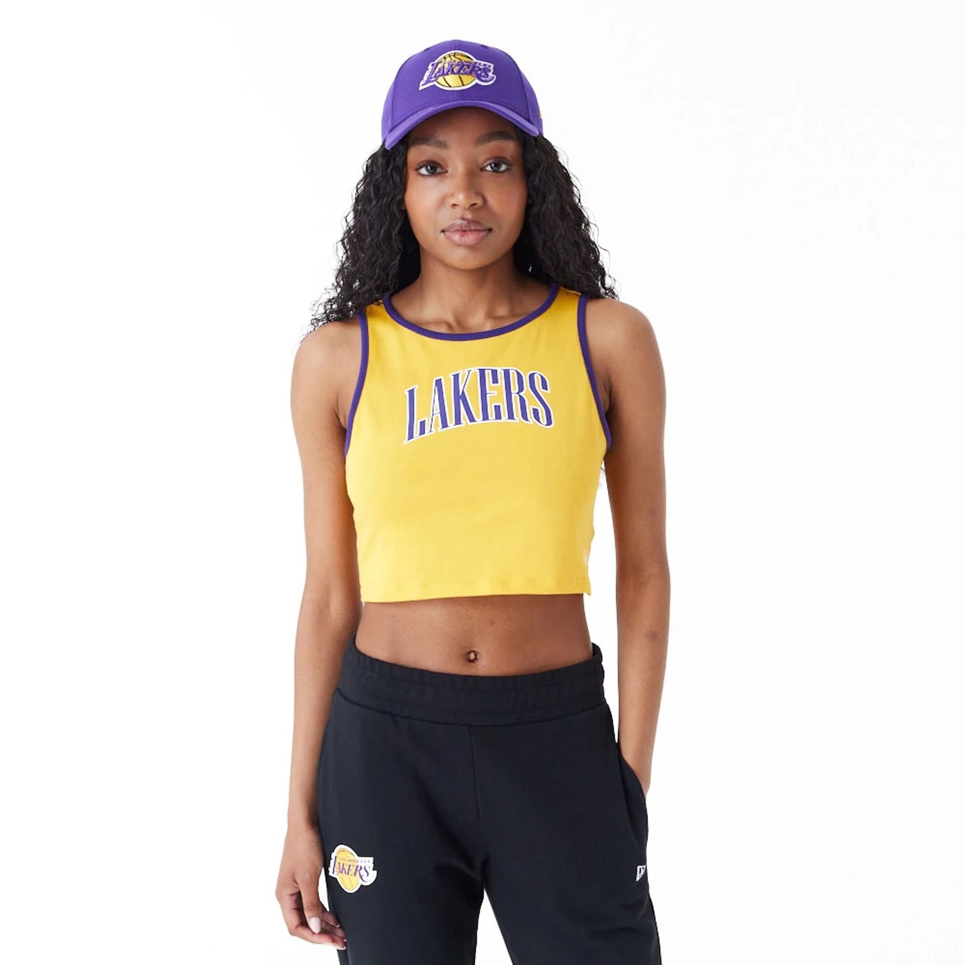 The Female model is wearing LA Lakers Womens Womens NBA Team Wordmark Yellow Crop Tank Top 1