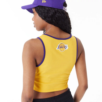 The Female model is wearing LA Lakers Womens Womens NBA Team Wordmark Yellow Crop Tank Top 4