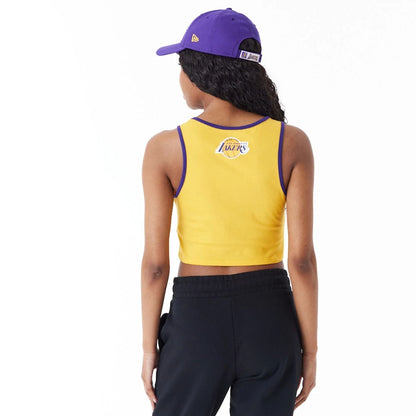 The Female model is wearing LA Lakers Womens Womens NBA Team Wordmark Yellow Crop Tank Top 5