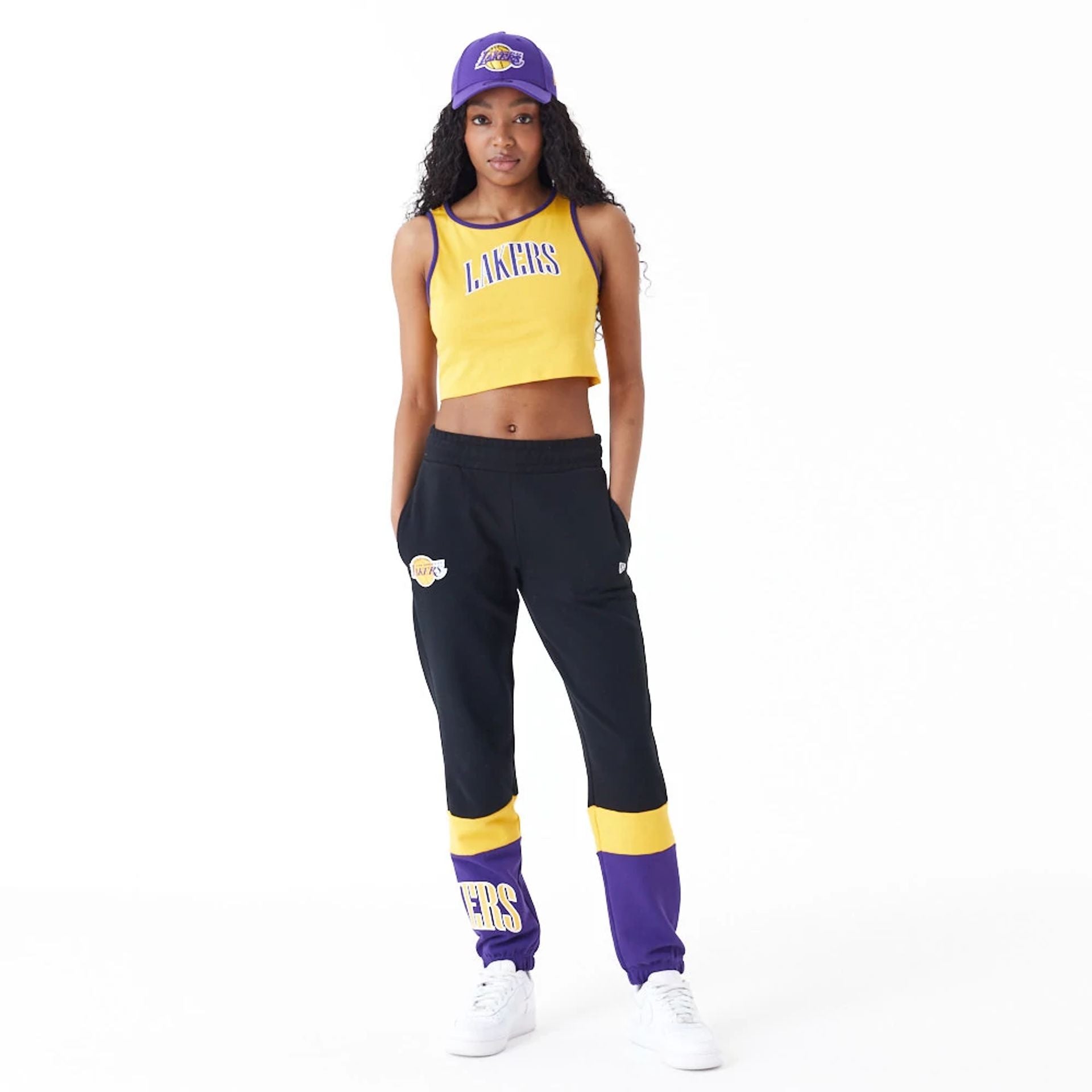 The Female model is wearing LA Lakers Womens Womens NBA Team Wordmark Yellow Crop Tank Top 6