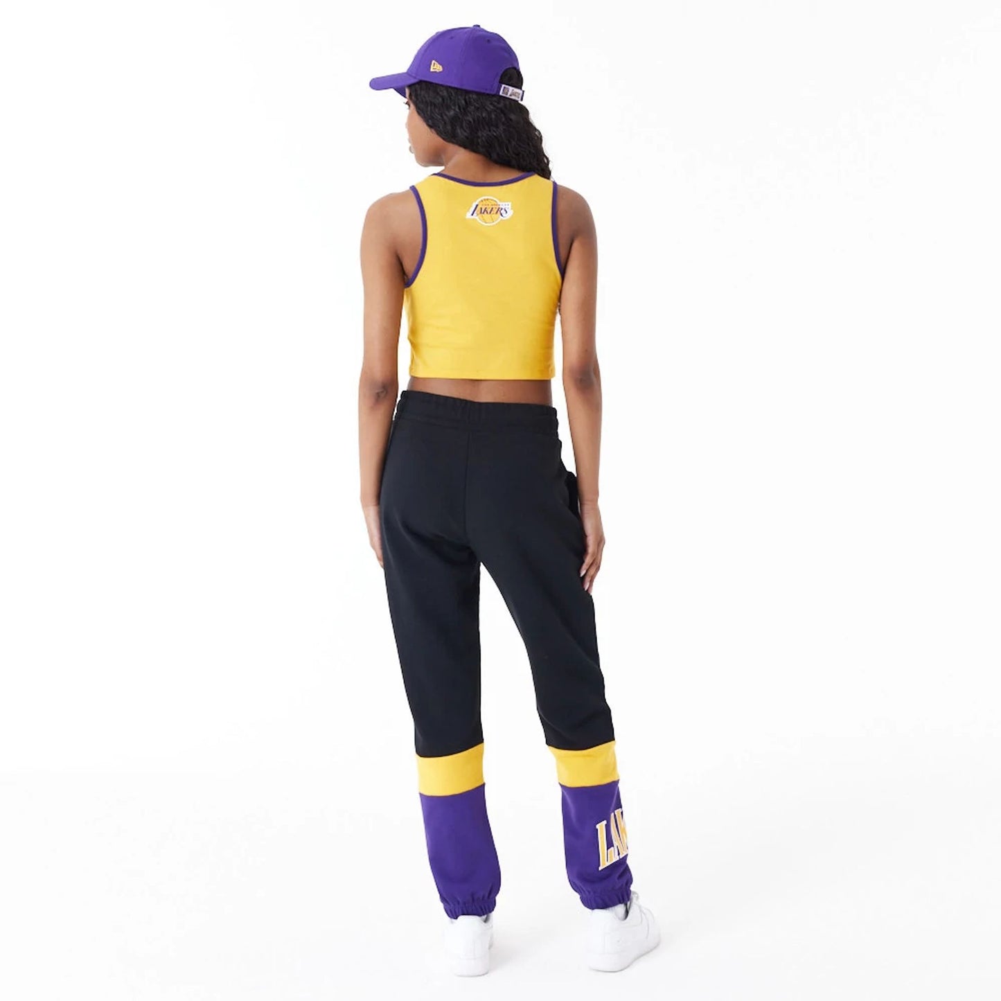 The Female model is wearing LA Lakers Womens Womens NBA Team Wordmark Yellow Crop Tank Top 7