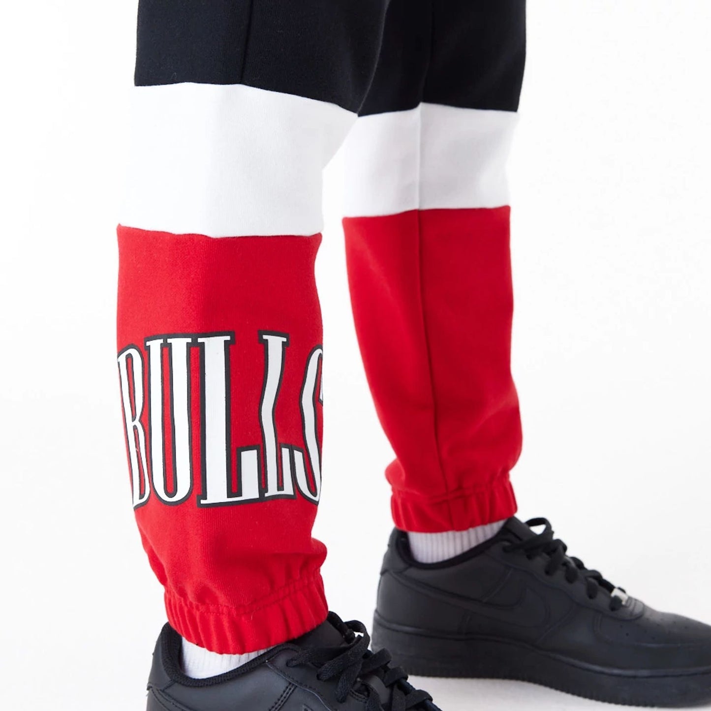 The Female model is wearing Chicago Bulls NBA Colour Block Black Joggers 4