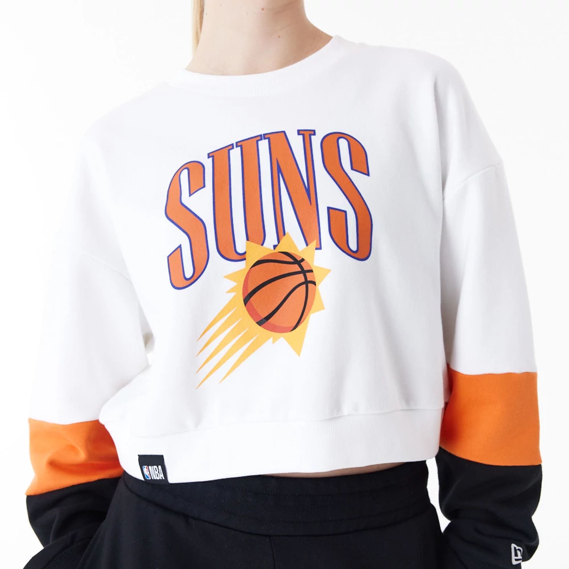 The Female model is wearing Phoenix Suns Womens NBA Colour Block White Crop Crew Neck Sweatshirt 2