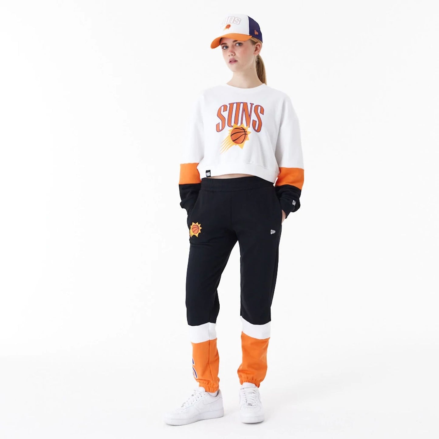 The Female model is wearing Phoenix Suns Womens NBA Colour Block White Crop Crew Neck Sweatshirt 4