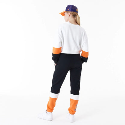 The Female model is wearing Phoenix Suns Womens NBA Colour Block White Crop Crew Neck Sweatshirt 7