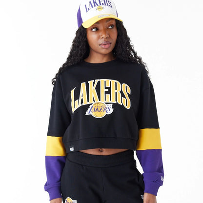 The Female model is wearing LA Lakers Womens NBA Colour Block Black Crop Crew Neck Sweatshirt 3