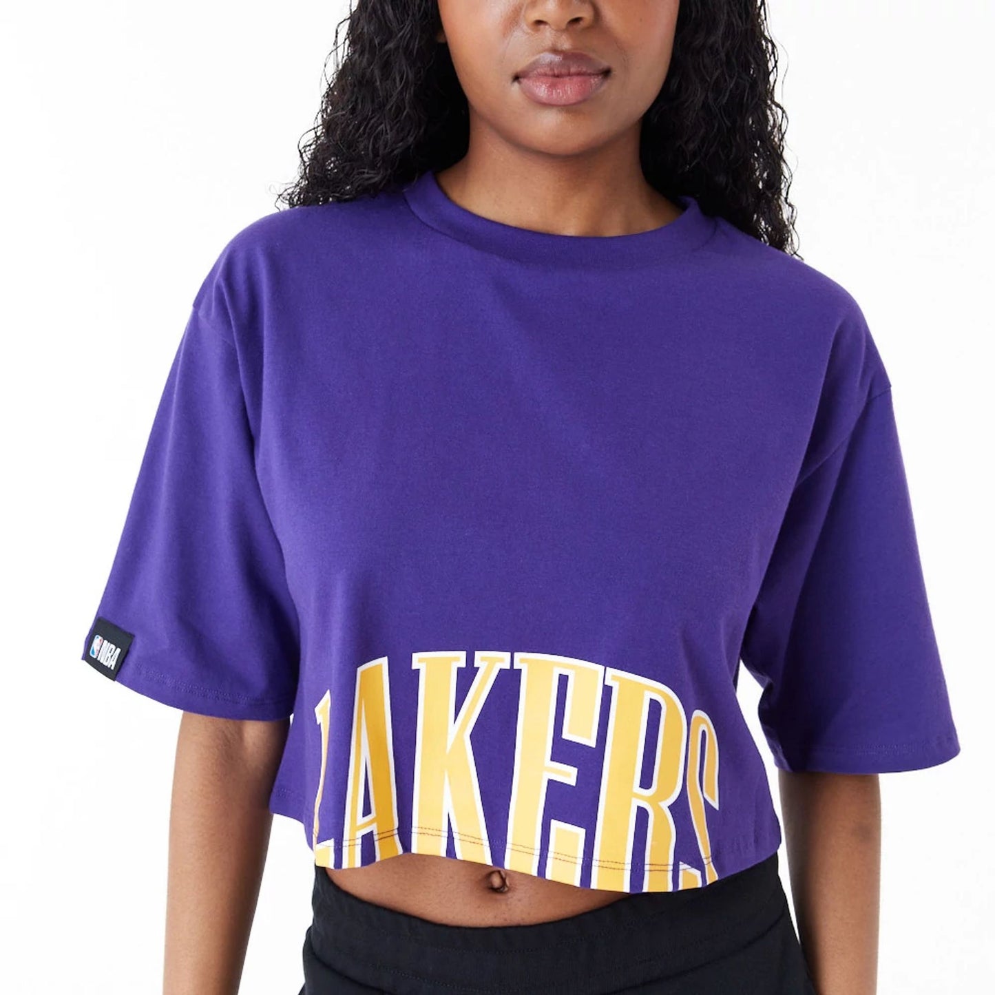 The Female model is wearing LA Lakers Womens NBA Team Wordmark Purple Crop T-Shirt 7