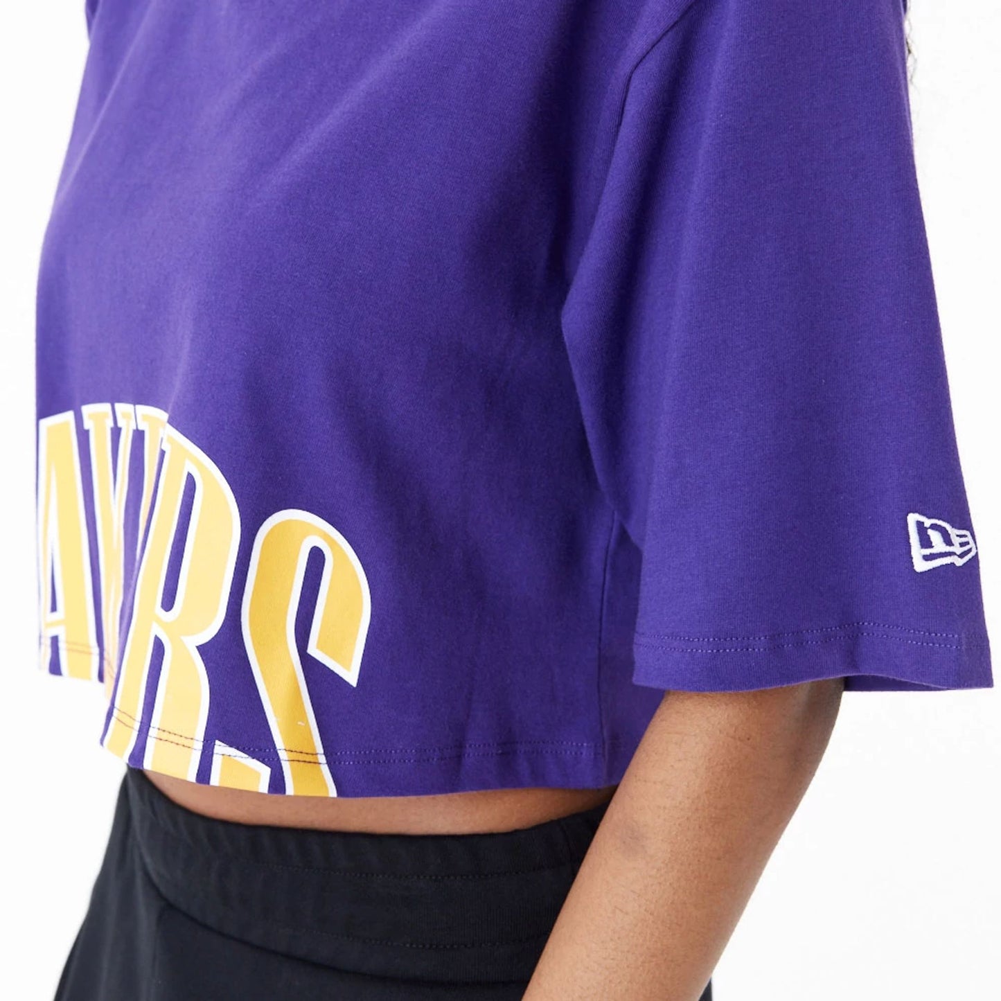 The Female model is wearing LA Lakers Womens NBA Team Wordmark Purple Crop T-Shirt 8