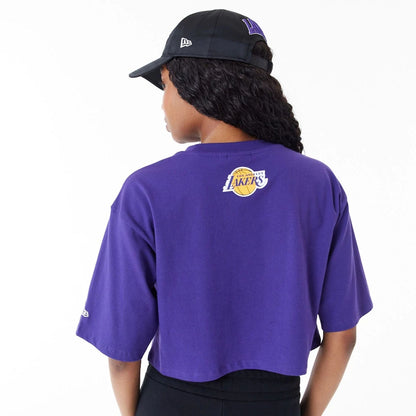 The Female model is wearing LA Lakers Womens NBA Team Wordmark Purple Crop T-Shirt 2