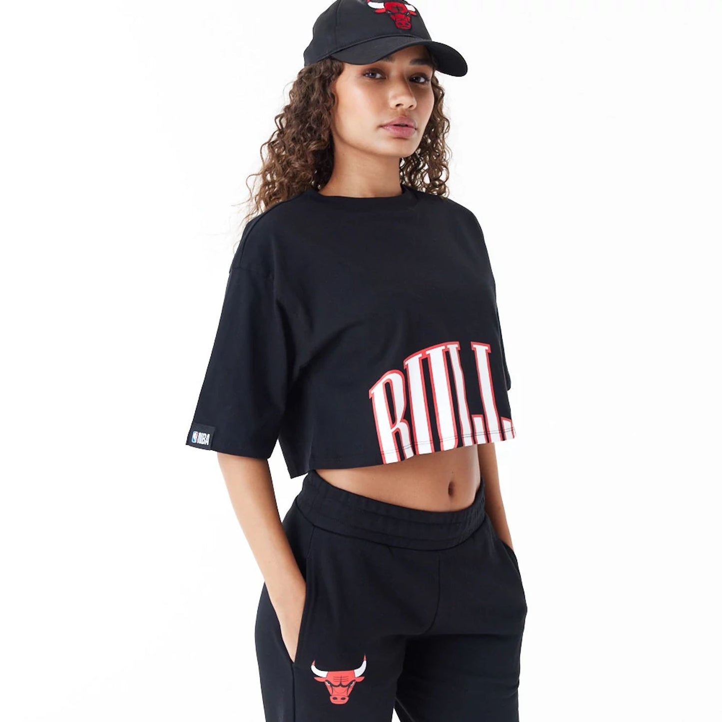 The Female model is wearing Chicago Bulls Womens NBA Team Wordmark Black Crop T-Shirt 6