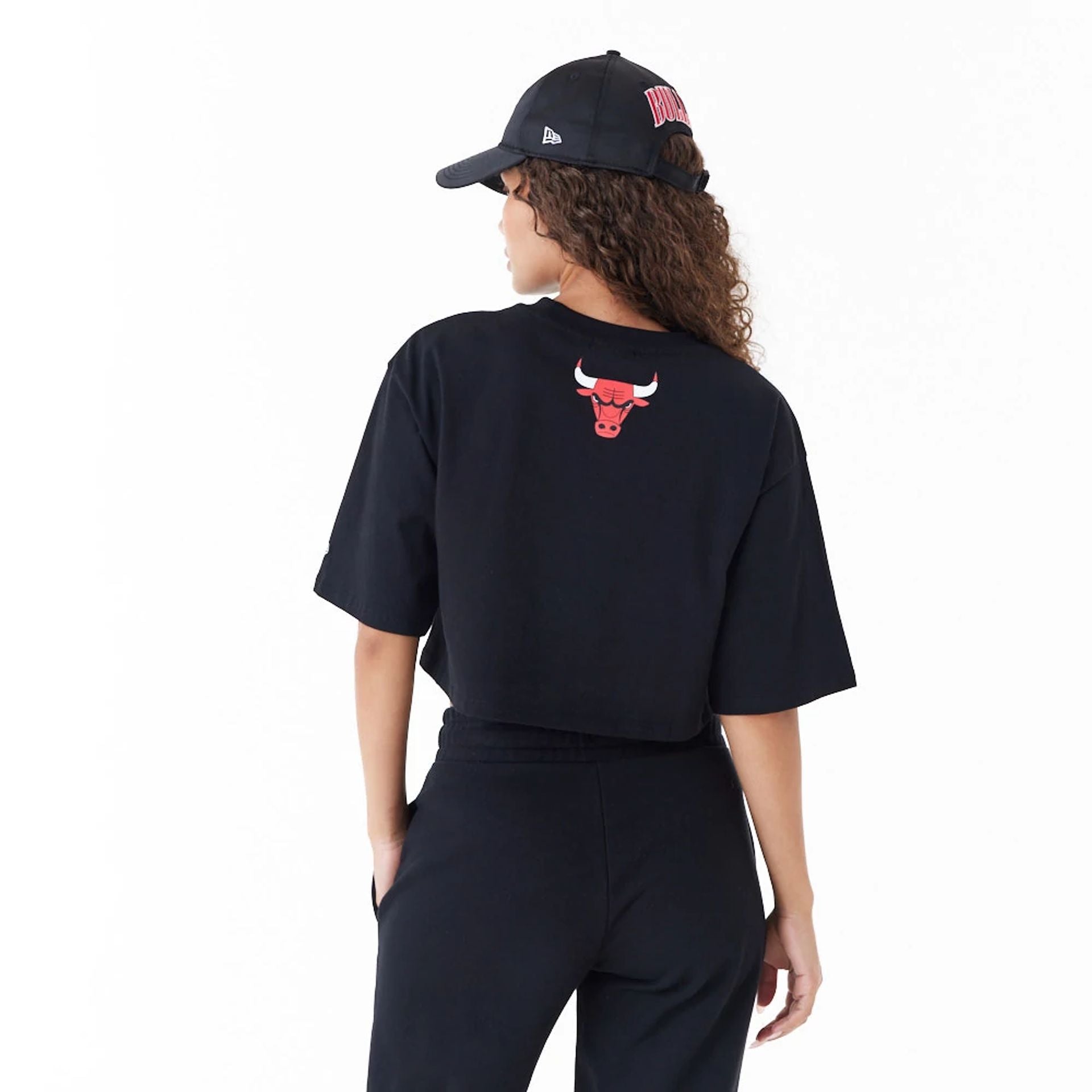 The Female model is wearing Chicago Bulls Womens NBA Team Wordmark Black Crop T-Shirt 2