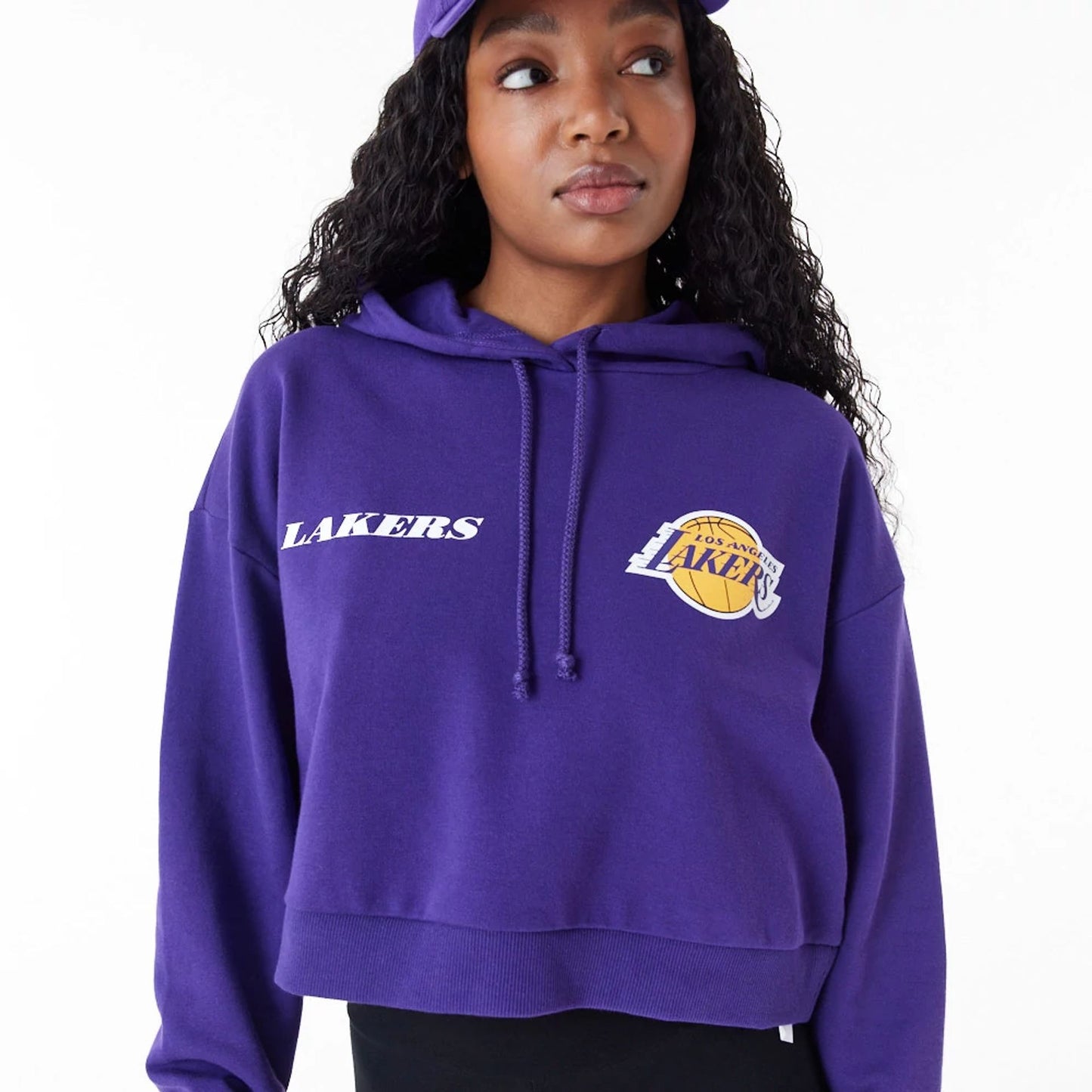 The Female model is wearing LA Lakers Womens NBA Team Logo Purple Crop Pullover Hoodie 2