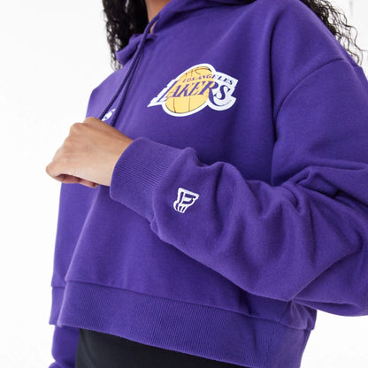 The Female model is wearing LA Lakers Womens NBA Team Logo Purple Crop Pullover Hoodie 3