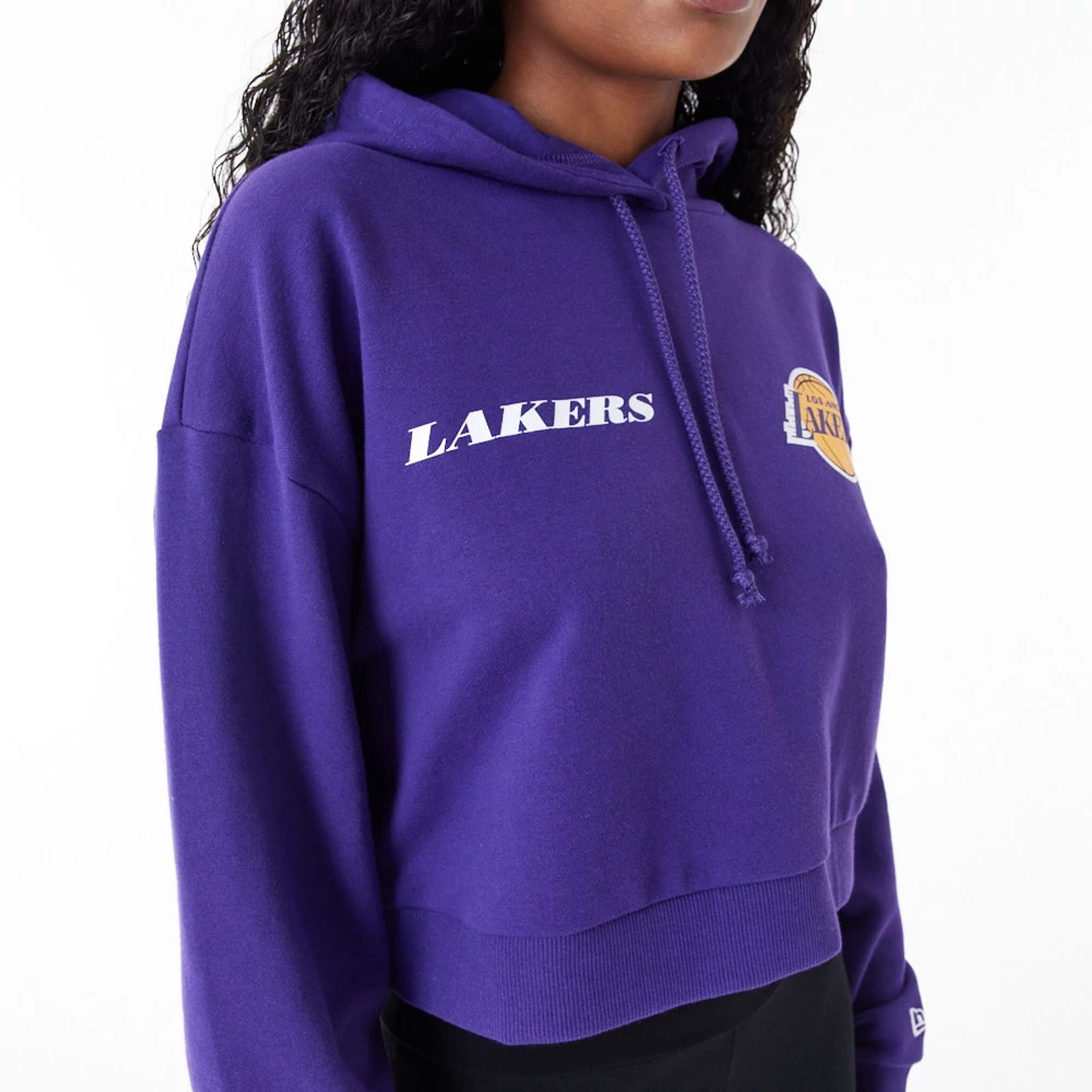 The Female model is wearing LA Lakers Womens NBA Team Logo Purple Crop Pullover Hoodie 4