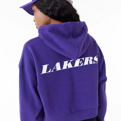 The Female model is wearing LA Lakers Womens NBA Team Logo Purple Crop Pullover Hoodie 5