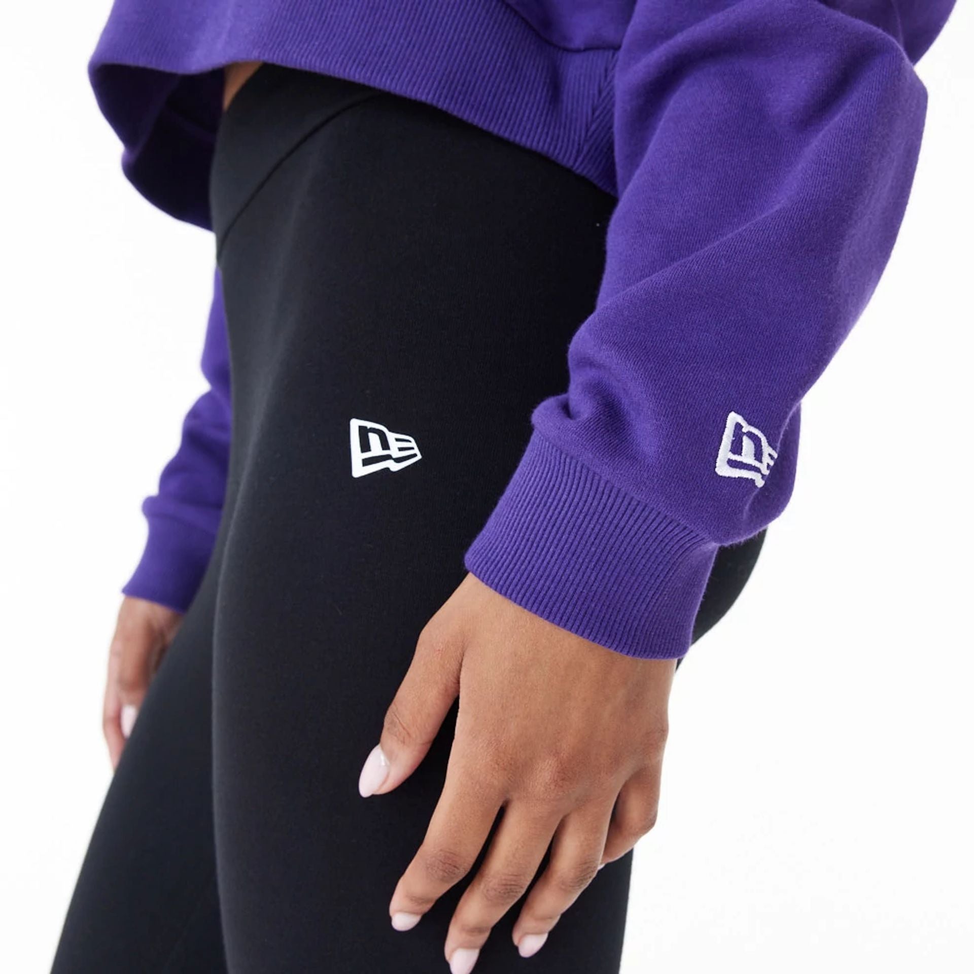 The Female model is wearing LA Lakers Womens NBA Team Logo Purple Crop Pullover Hoodie 6