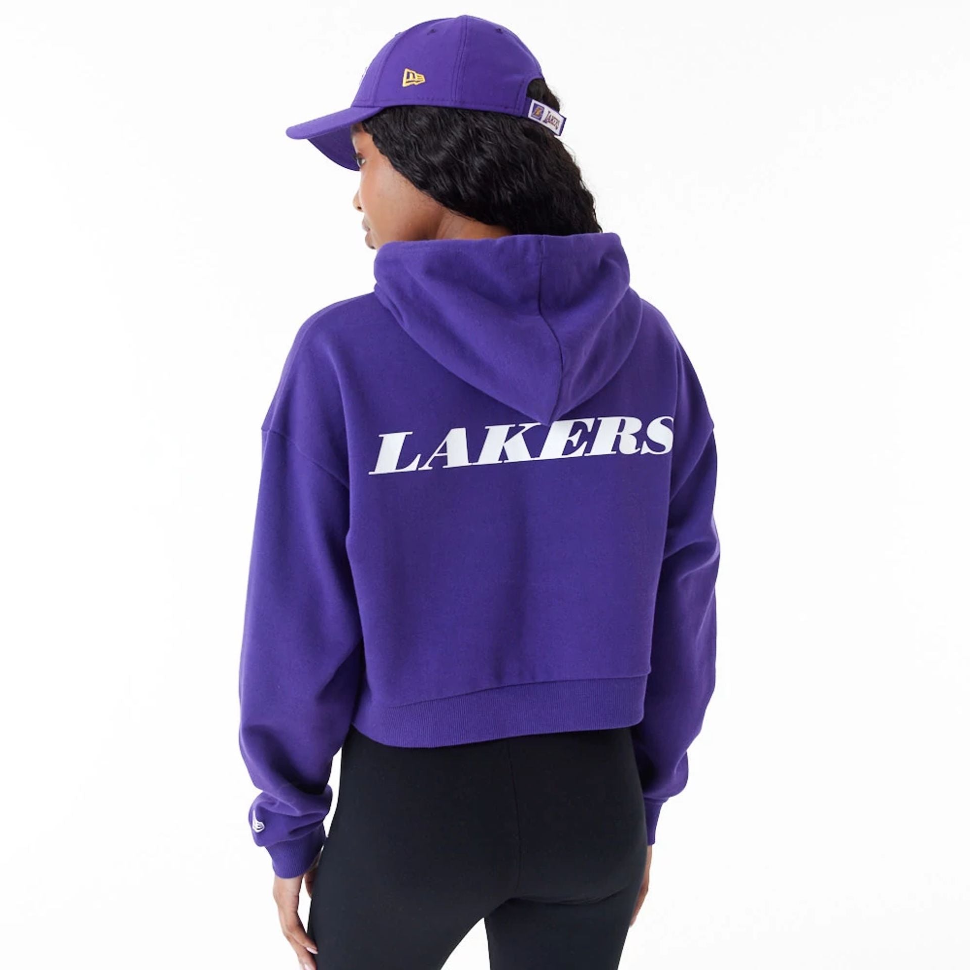 The Female model is wearing LA Lakers Womens NBA Team Logo Purple Crop Pullover Hoodie 7