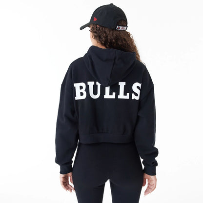 The Female model is wearing Chicago Bulls Womens NBA Team Logo Black Crop Pullover Hoodie 2