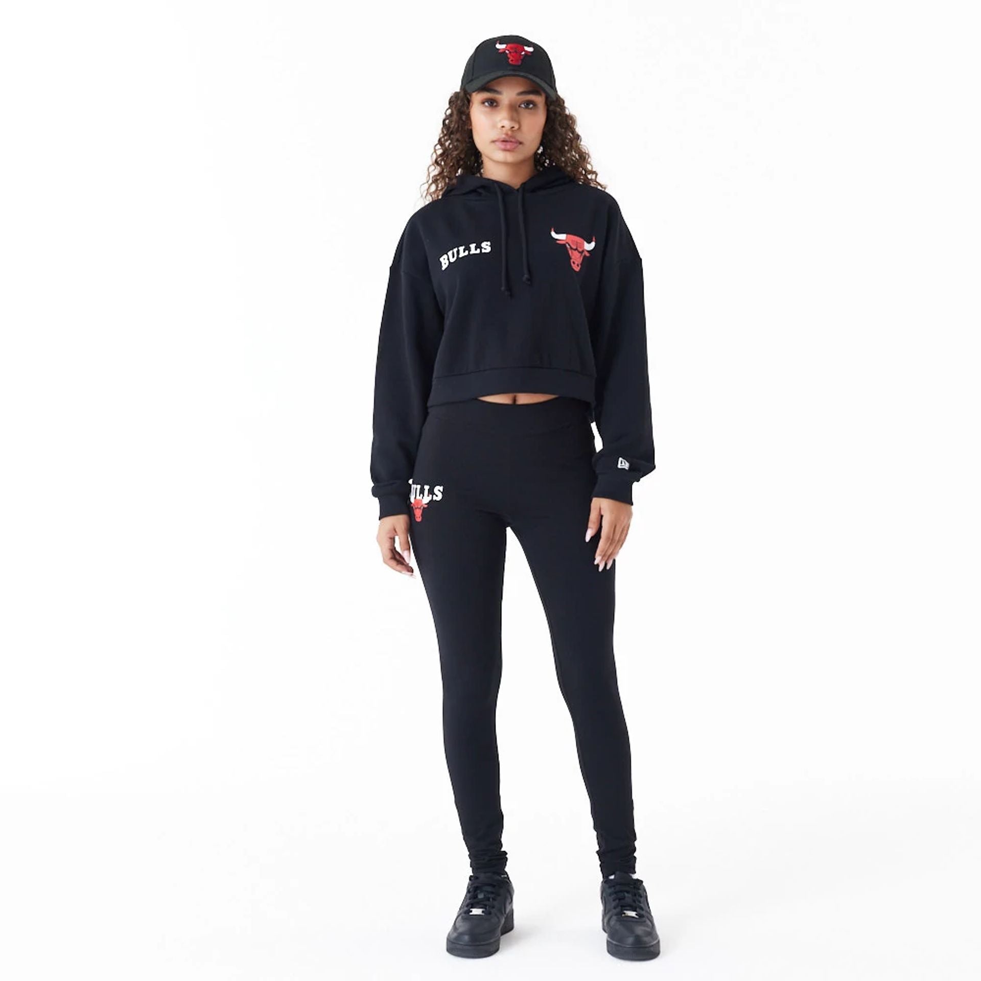 The Female model is wearing Chicago Bulls Womens NBA Team Logo Black Crop Pullover Hoodie 5