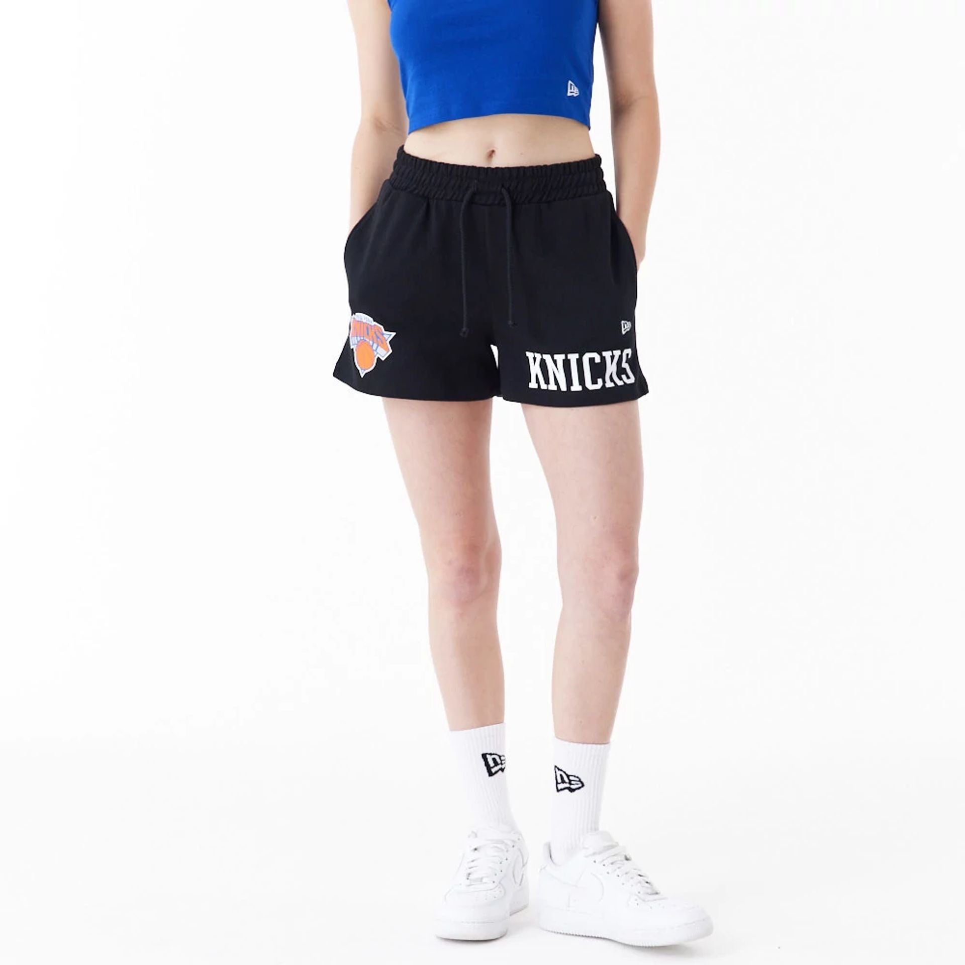 The Female model is wearing New York Knicks Womens NBA Team Logo Black Shorts 1