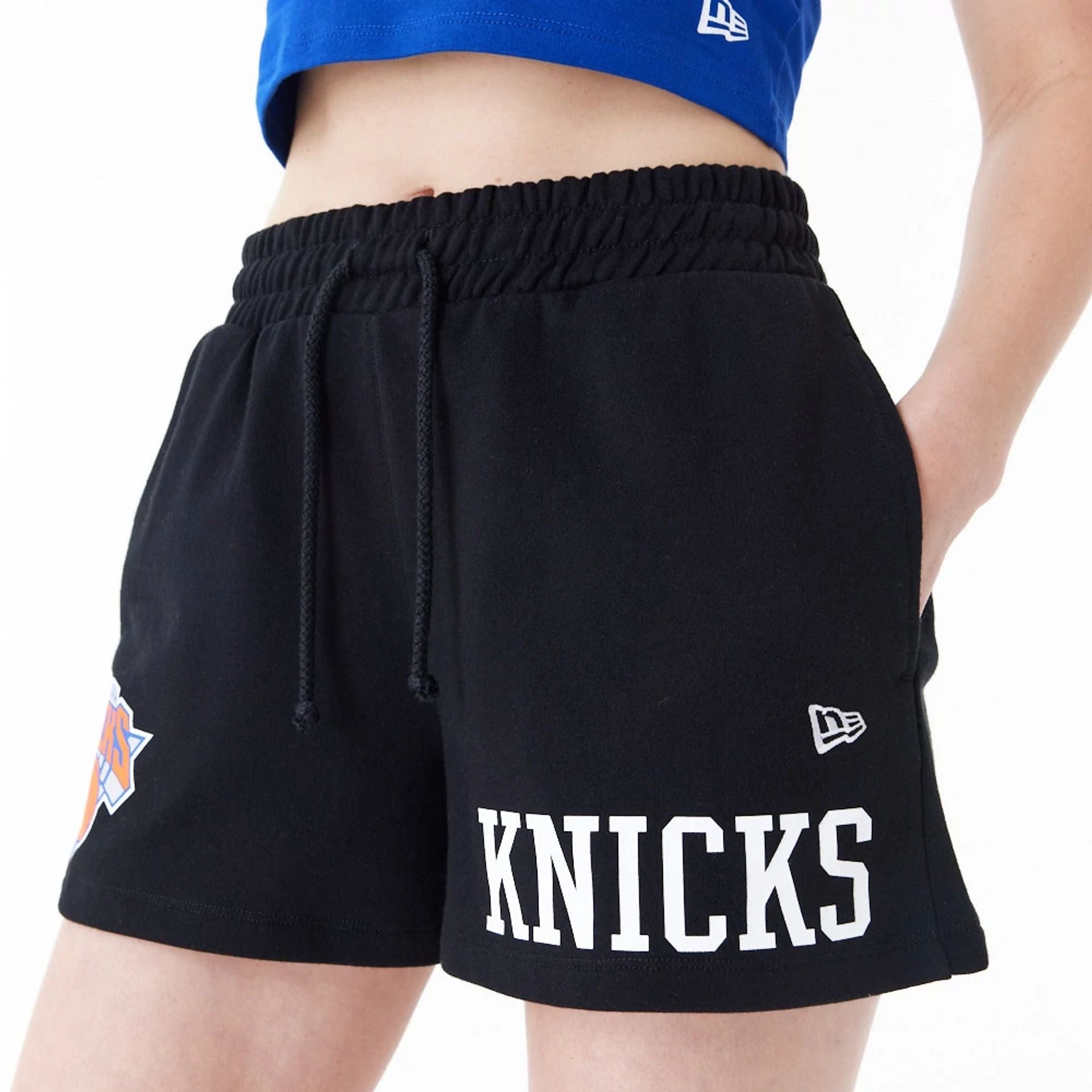 The Female model is wearing New York Knicks Womens NBA Team Logo Black Shorts 5