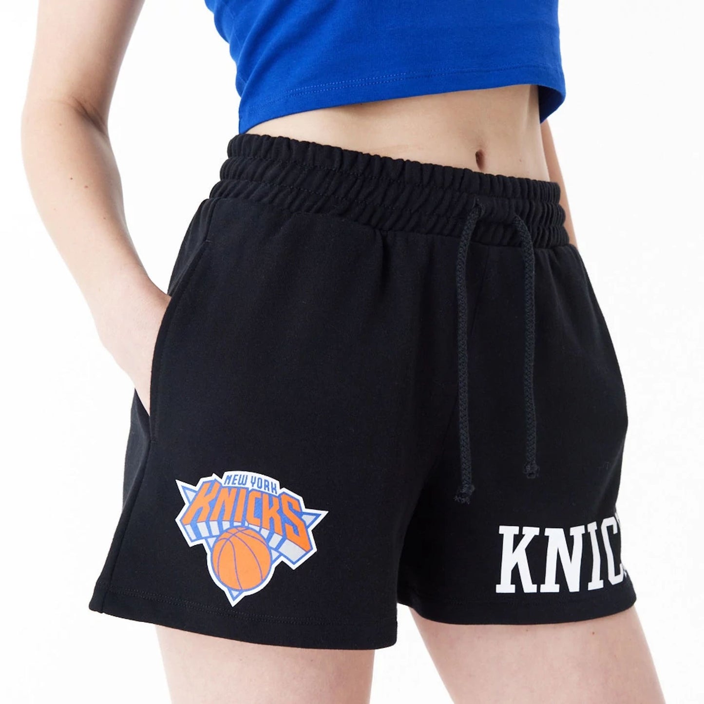 The Female model is wearing New York Knicks Womens NBA Team Logo Black Shorts 6