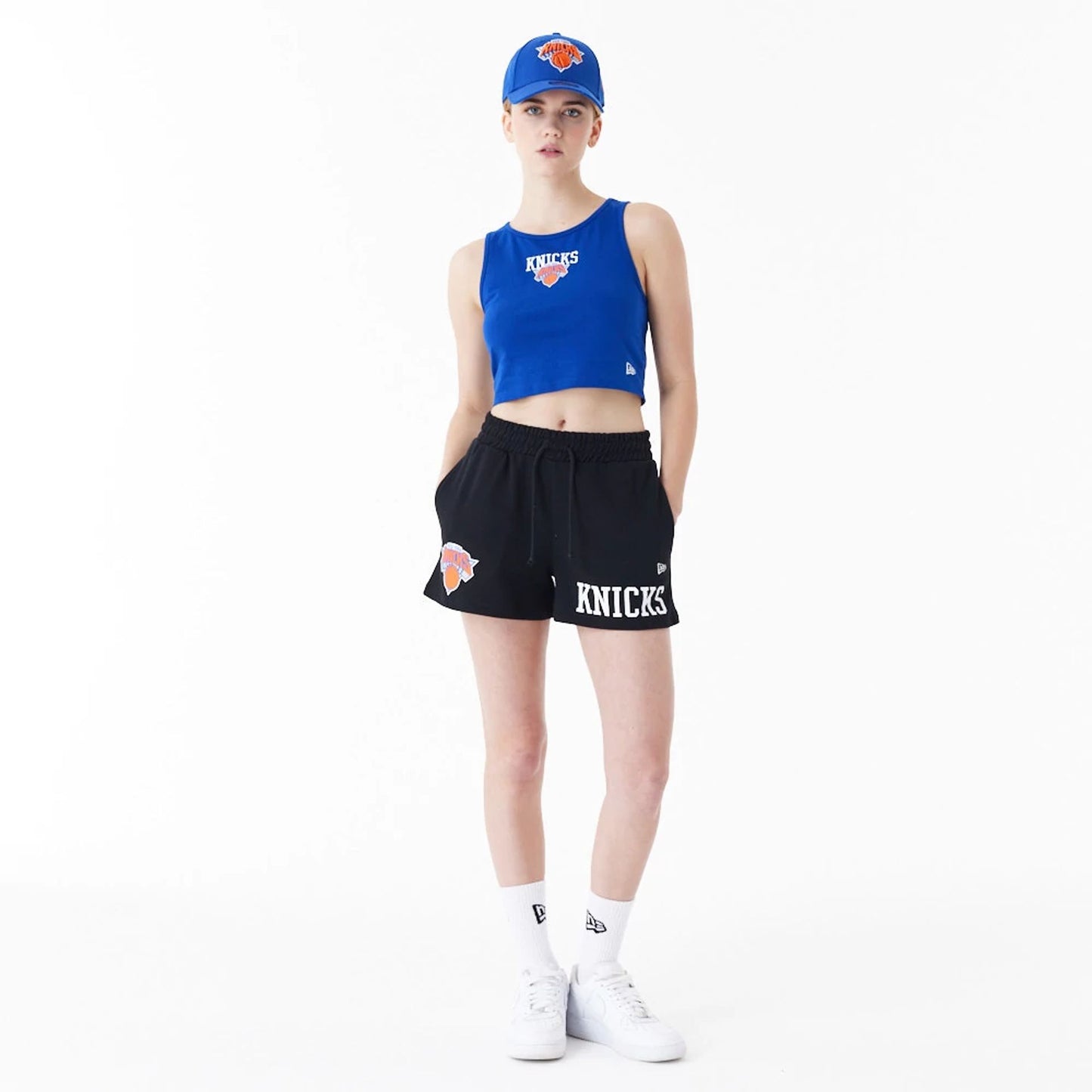 The Female model is wearing New York Knicks Womens NBA Team Logo Black Shorts 3