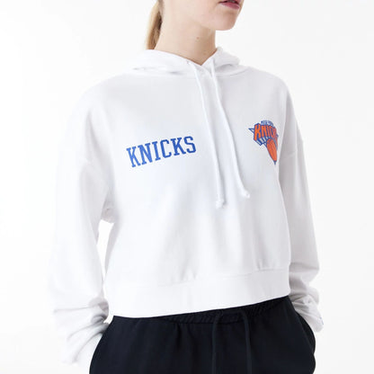 The Female model is wearing New York Knicks Womens NBA Team Logo White Crop Pullover Hoodie 8