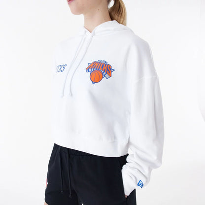 The Female model is wearing New York Knicks Womens NBA Team Logo White Crop Pullover Hoodie 5