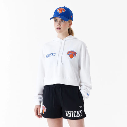 The Female model is wearing New York Knicks Womens NBA Team Logo White Crop Pullover Hoodie 1