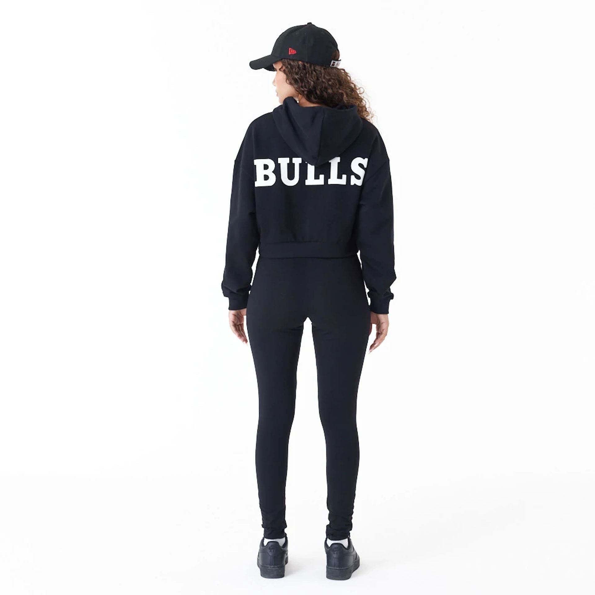 The Female model is wearing Chicago Bulls Womens NBA Team Bulls Logo Black Leggings 2