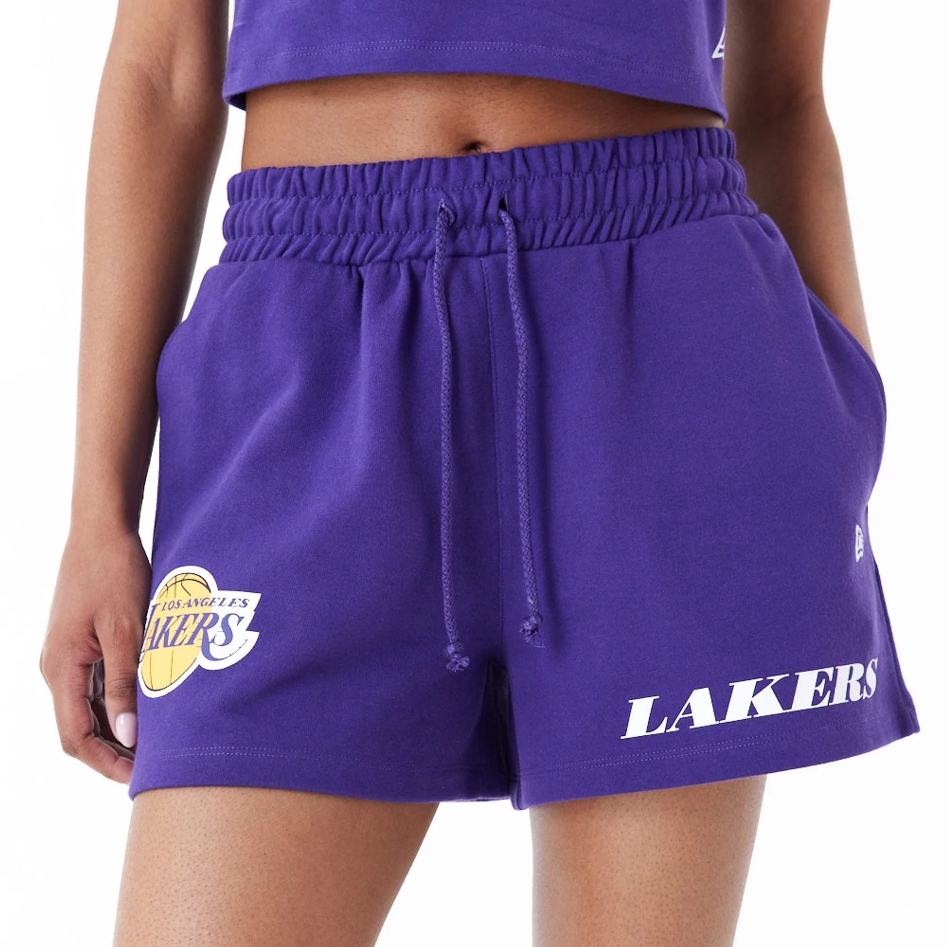 The Female model is wearing LA Lakers Womens NBA Team Logo Purple Shorts 2