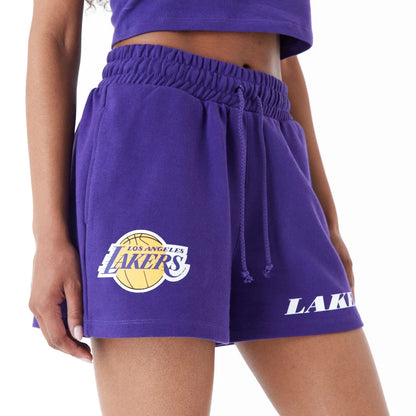 The Female model is wearing LA Lakers Womens NBA Team Logo Purple Shorts 4