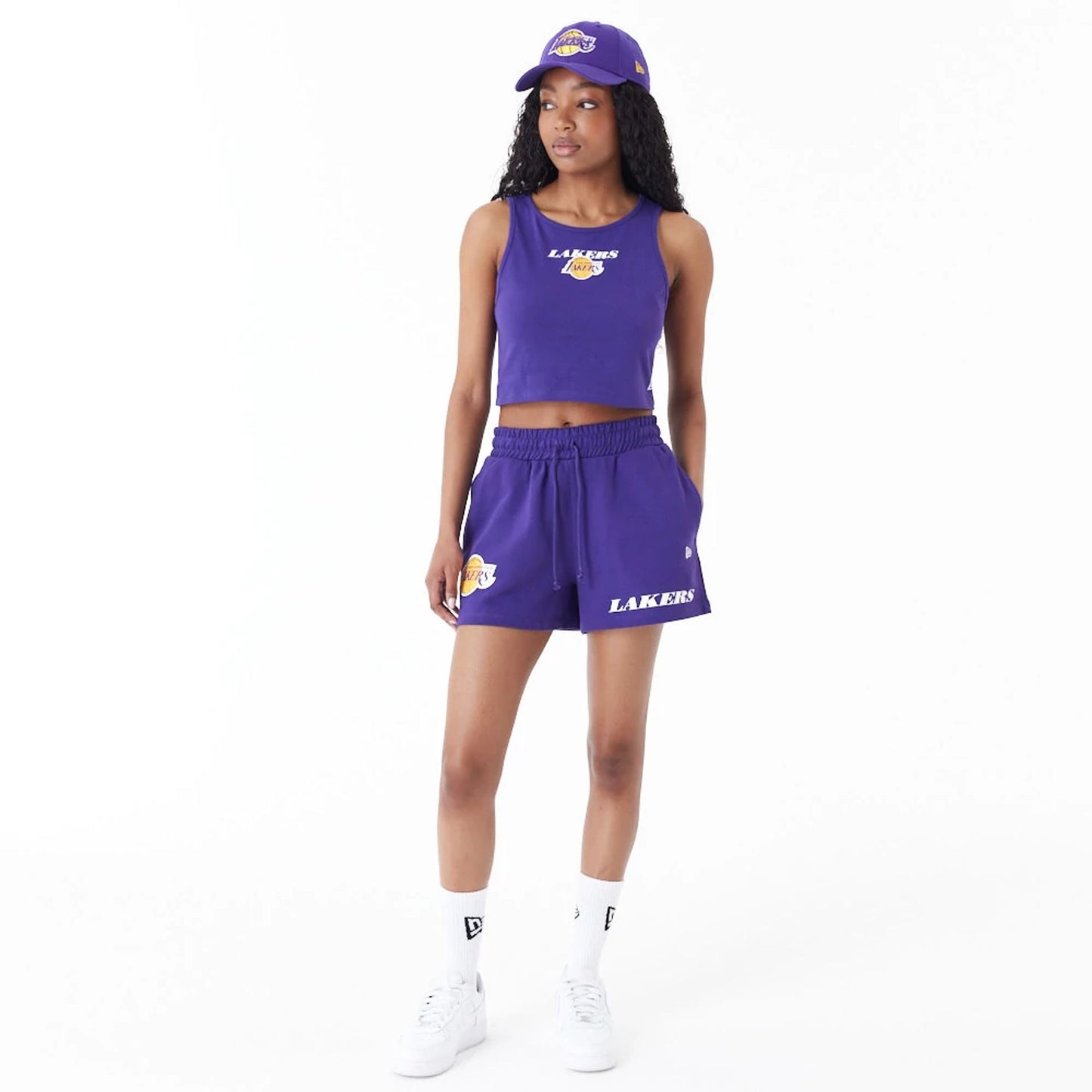 The Female model is wearing LA Lakers Womens NBA Team Logo Purple Shorts 8