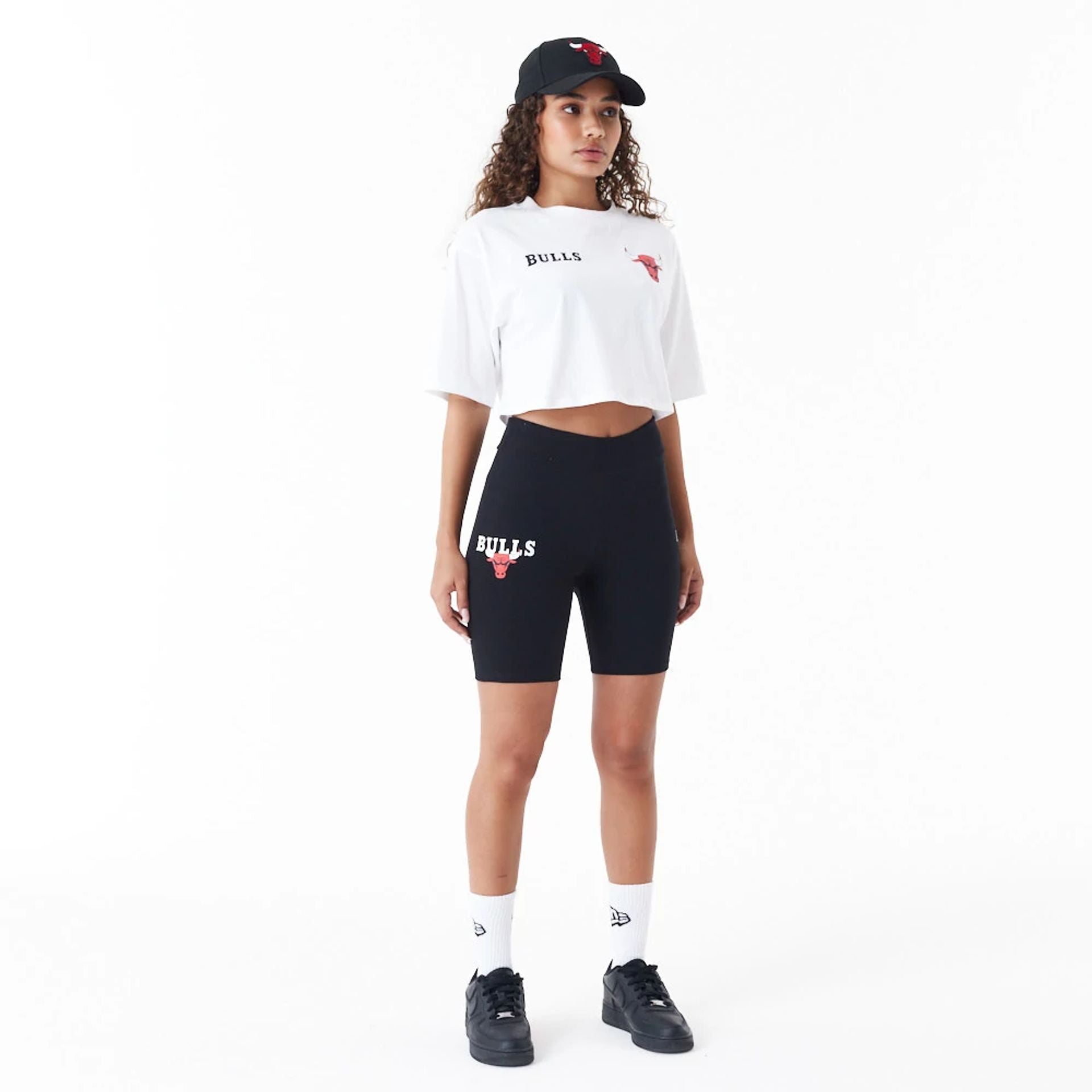 The Female model is wearing Chicago Bulls Womens NBA Logo Black Cycling Shorts 6