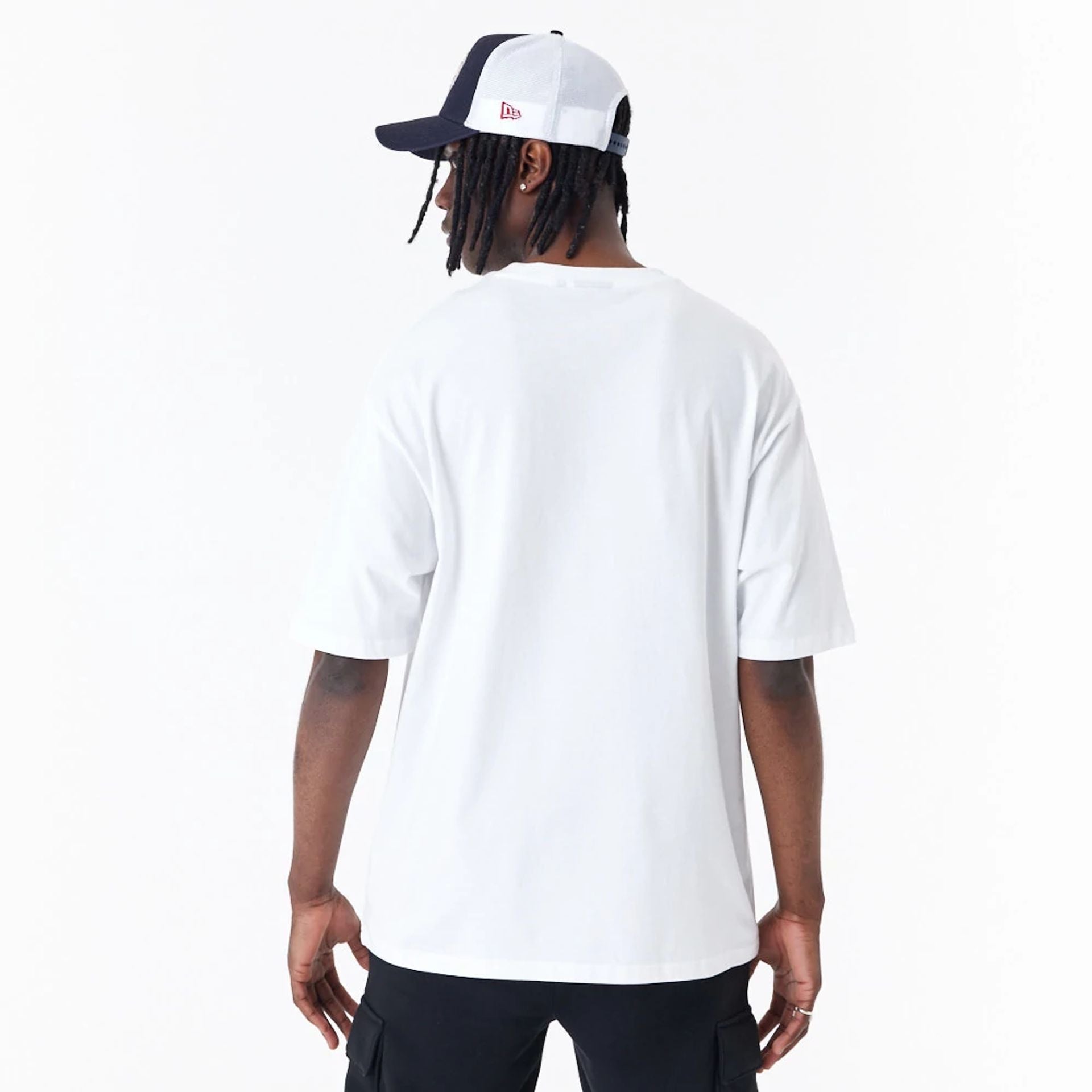 The Male model is wearing New Era Spray Graphic White Oversized T-Shirt 2