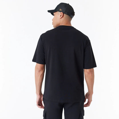 The Male model is wearing New Era Spray Graphic Black Oversized T-Shirt 7