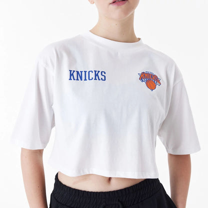 The Female model is wearing New York Knicks Womens NBA Team Logo White Crop T-Shirt 2