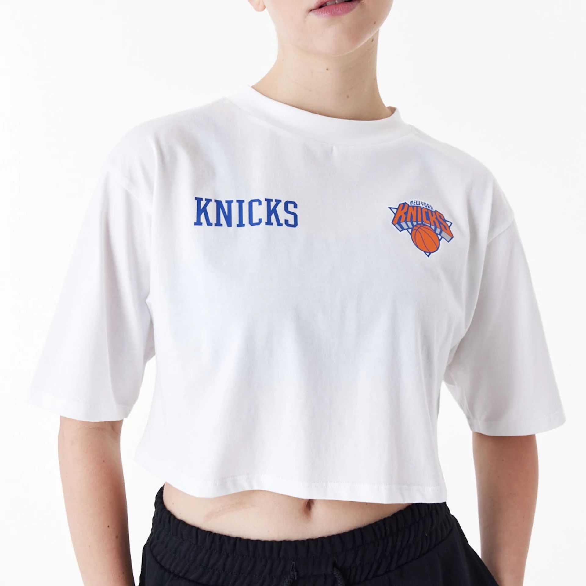 The Female model is wearing New York Knicks Womens NBA Team Logo White Crop T-Shirt 2