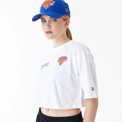 The Female model is wearing New York Knicks Womens NBA Team Logo White Crop T-Shirt 6