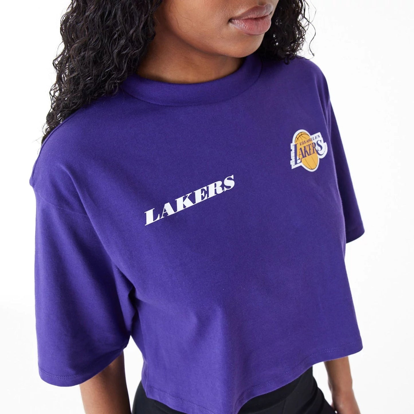 The Female model is wearing LA Lakers Womens NBA Team Logo Purple Crop T-Shirt 5