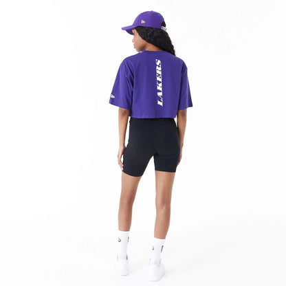 The Female model is wearing LA Lakers Womens NBA Team Logo Purple Crop T-Shirt 3