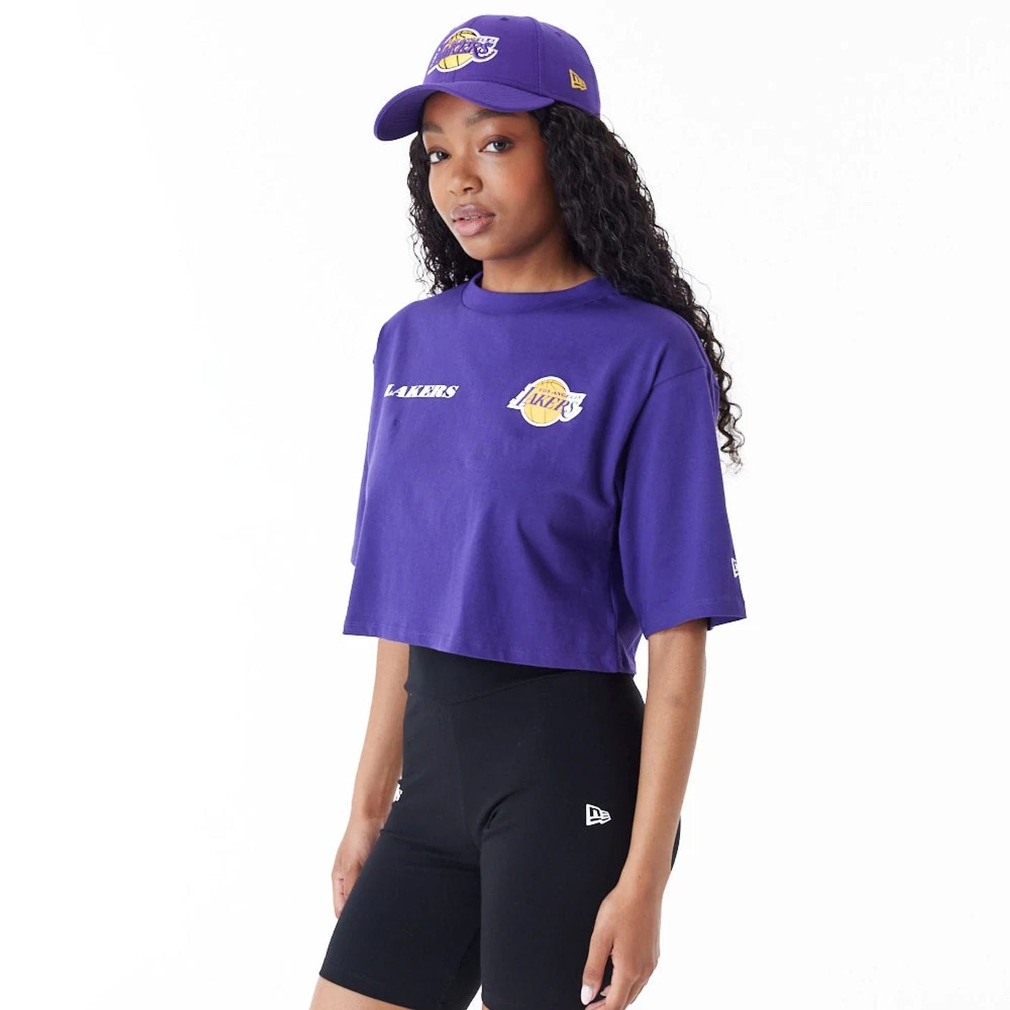 The Female model is wearing LA Lakers Womens NBA Team Logo Purple Crop T-Shirt 1