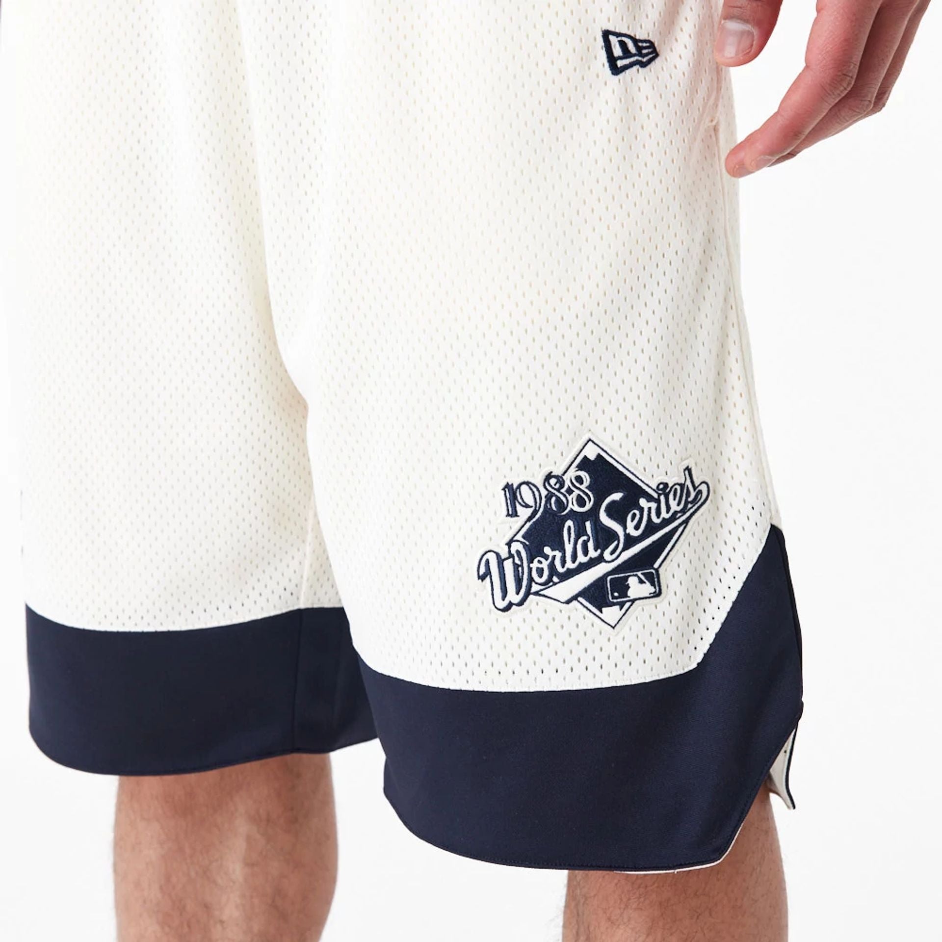 The Male model is wearing LA Dodgers MLB World Series Off White Mesh Shorts 2