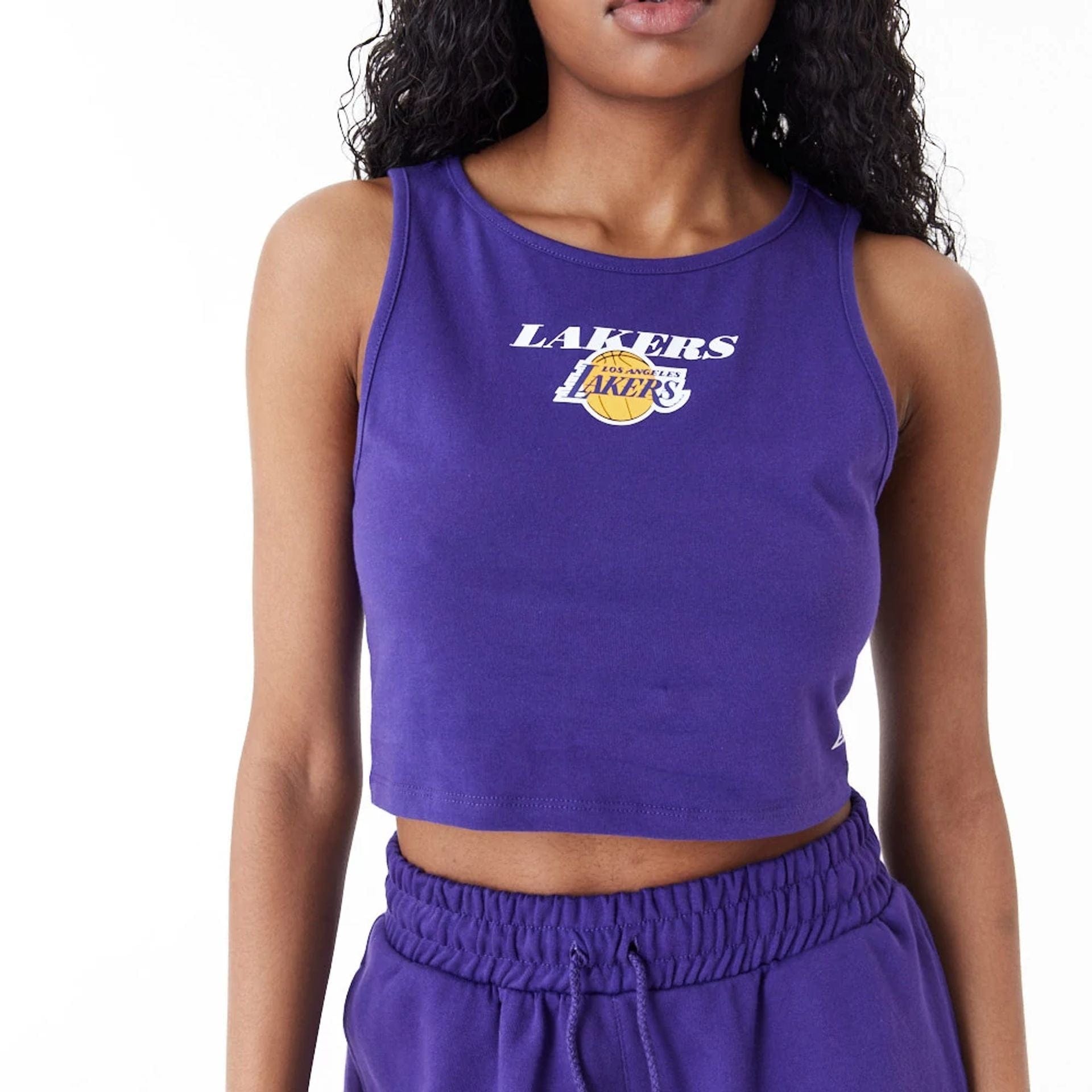 The Female model is wearing LA Lakers Women's NBA Team Logo Purple Crop Tank Top 2