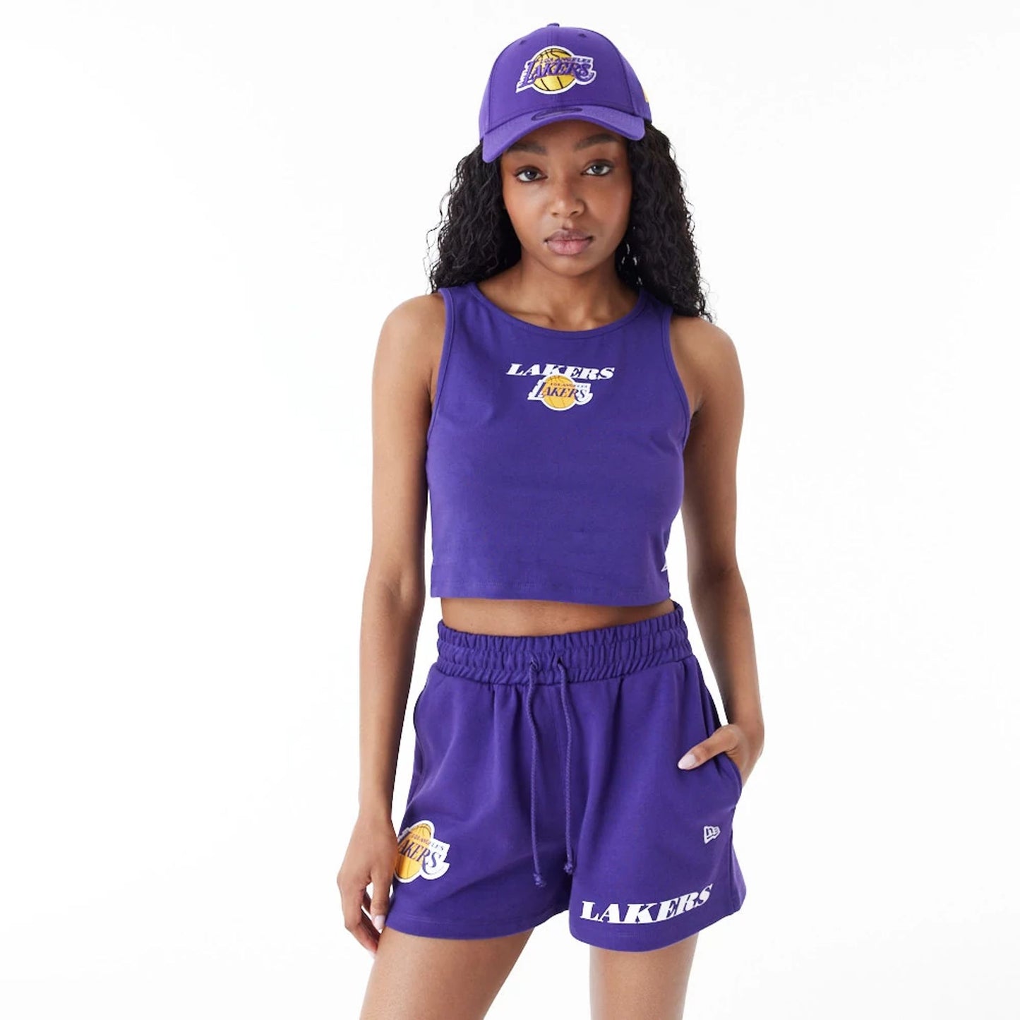 The Female model is wearing LA Lakers Women's NBA Team Logo Purple Crop Tank Top 1