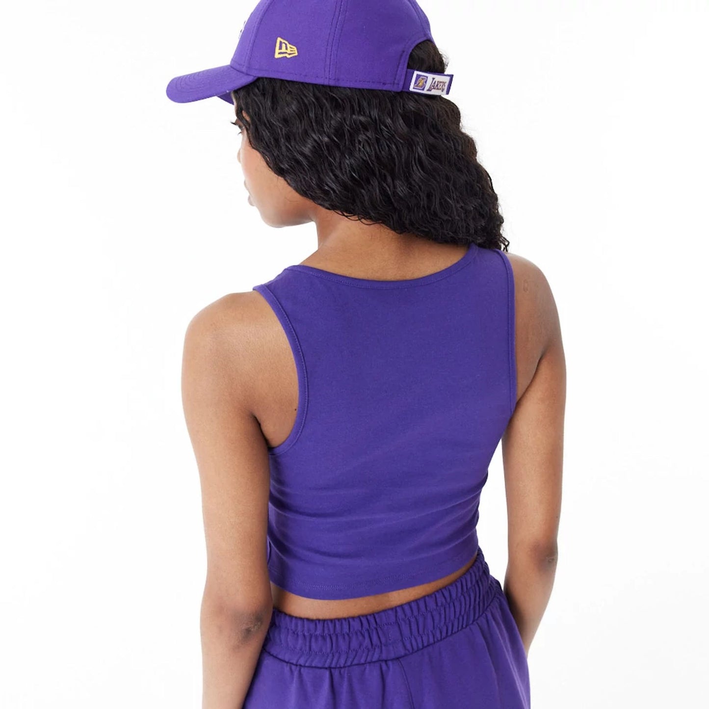 The Female model is wearing LA Lakers Women's NBA Team Logo Purple Crop Tank Top 5