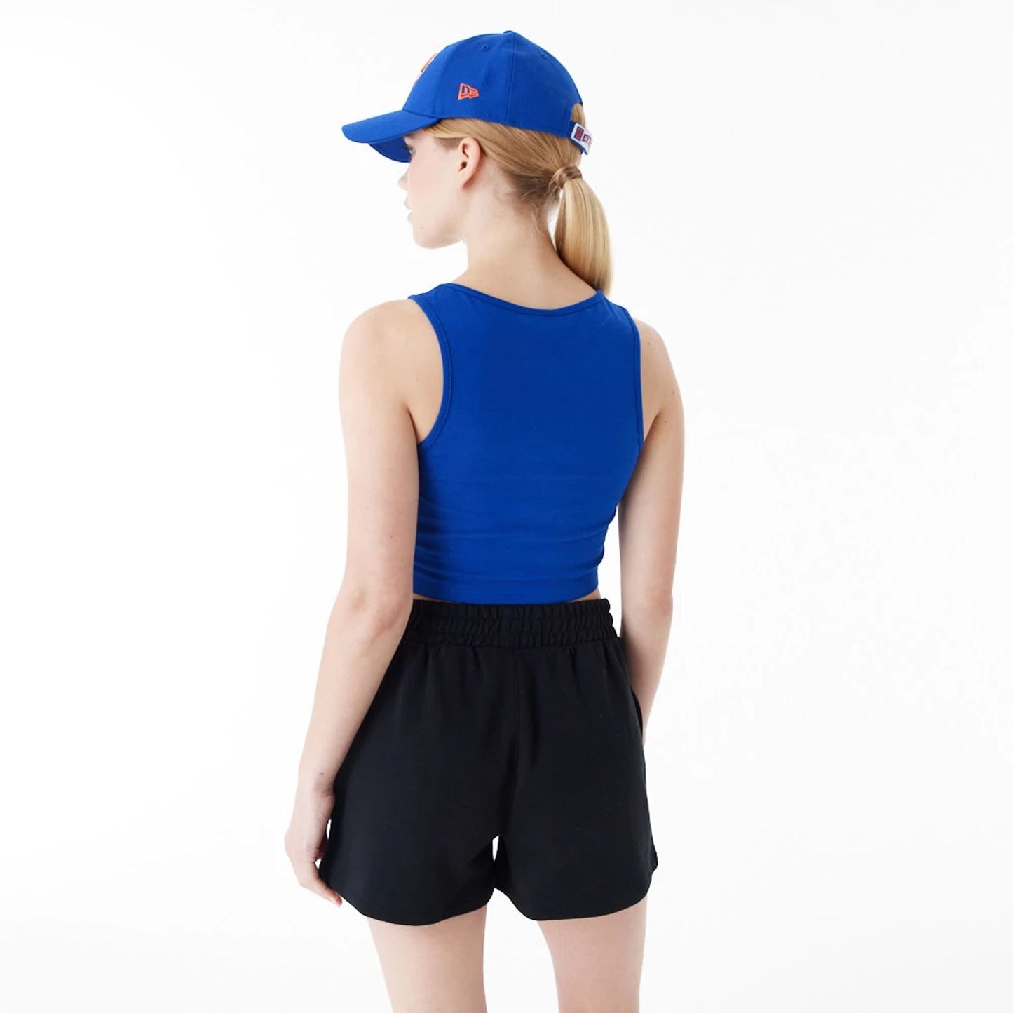 The Female model is wearing New York Knicks Womens NBA Team Logo Blue Crop Tank Top 6