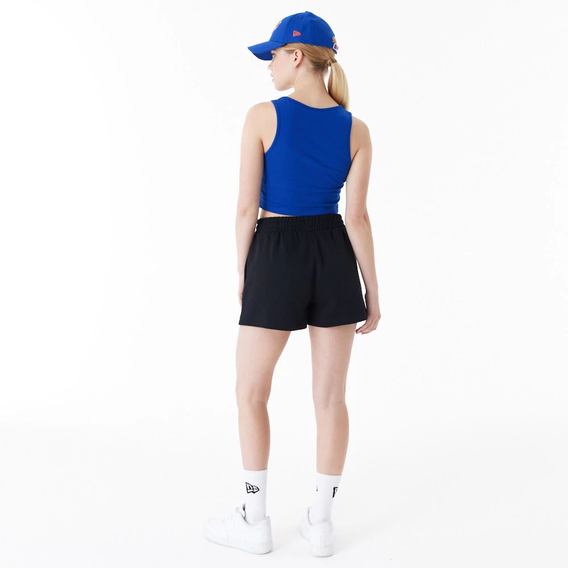 The Female model is wearing New York Knicks Womens NBA Team Logo Blue Crop Tank Top 8